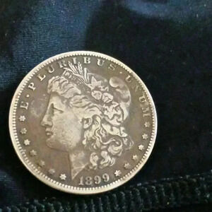 1899- O- Morgan dollar..100 percent AUTHENTIC..a must for collectors!